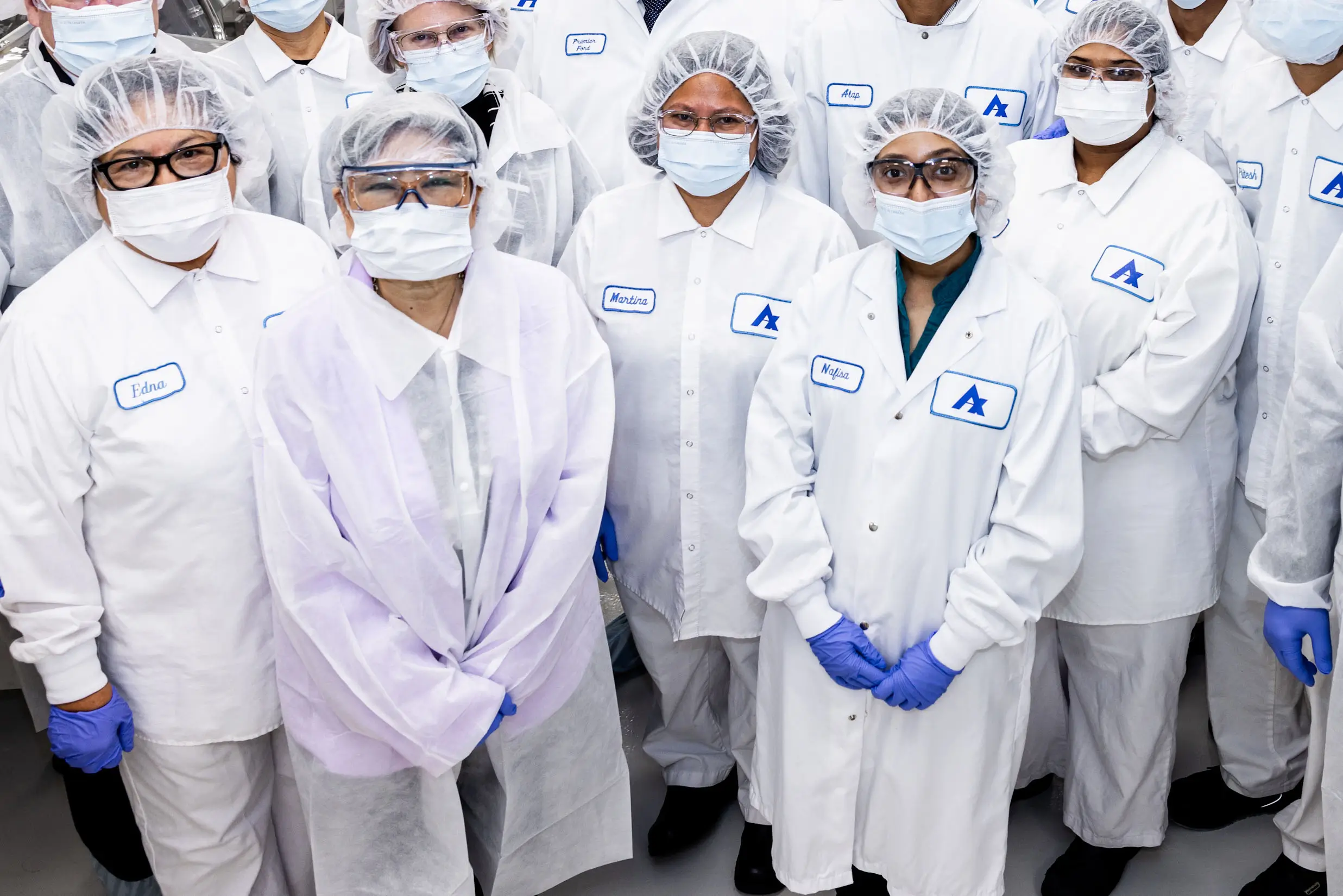 Manufacturing employees in lab gear