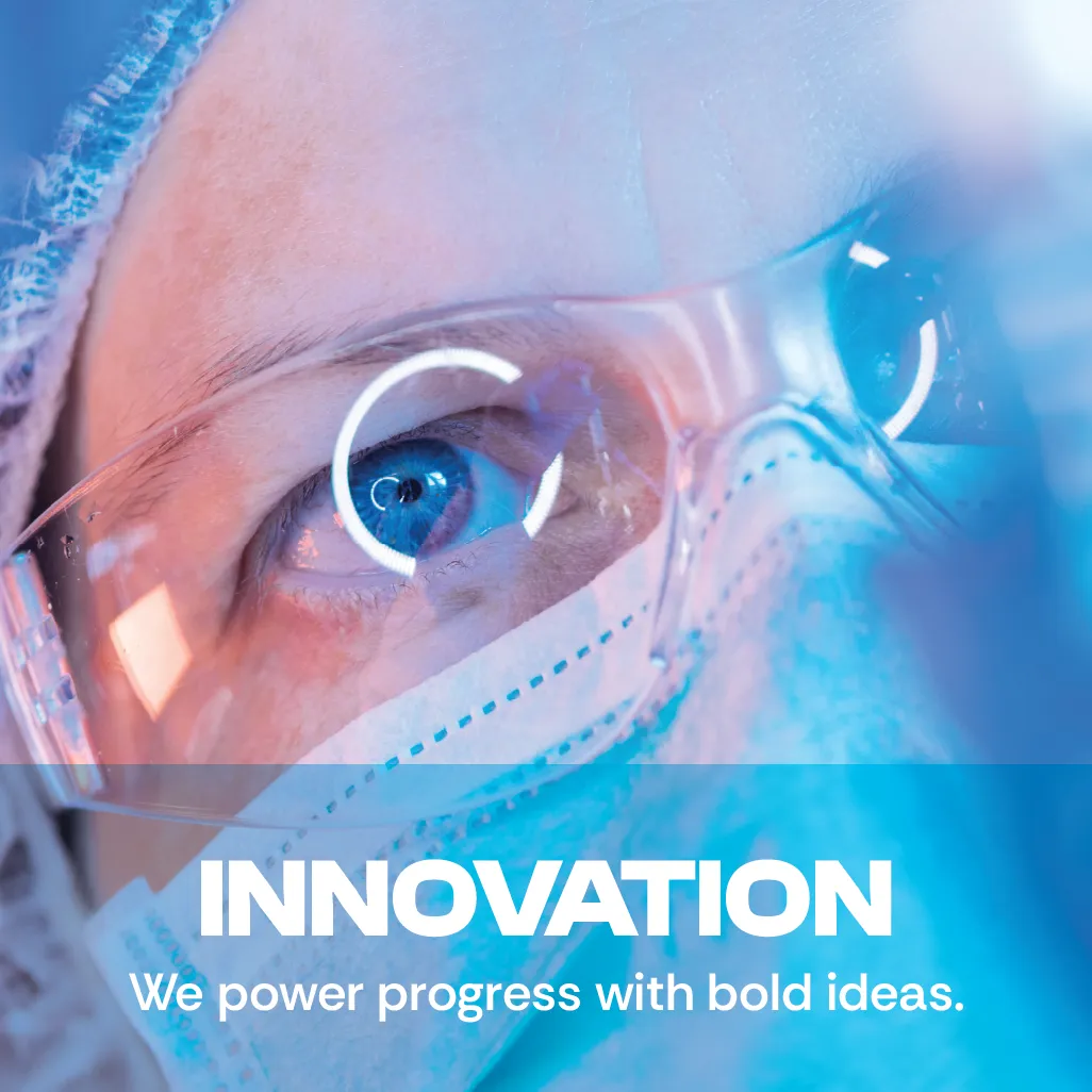 Innovation. We power progress with bold ideas. A close-up photo showing a scientist wearing protective glasses.