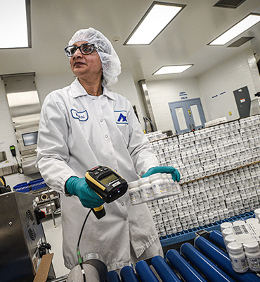 Woman in factory doing quality check