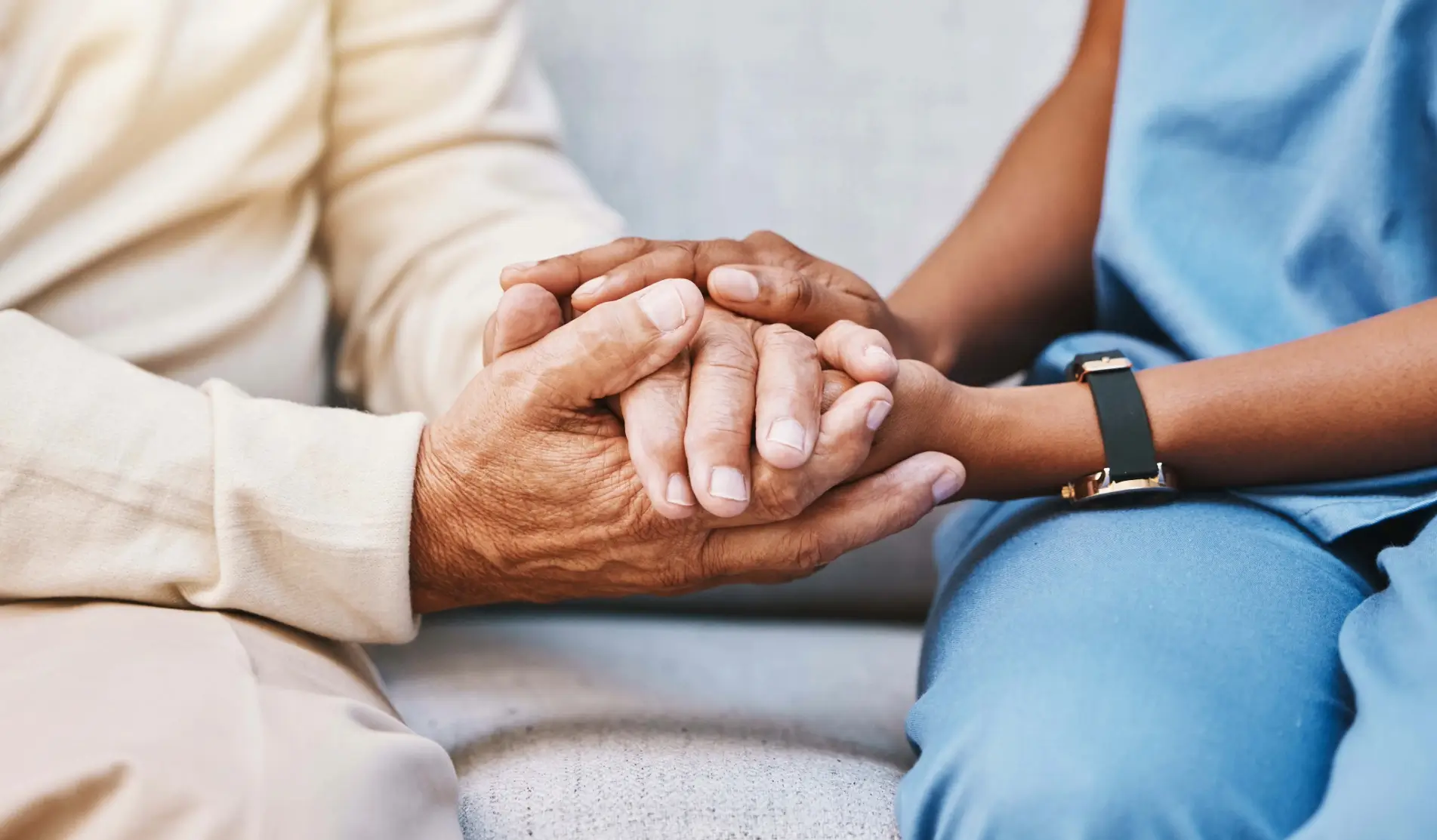 A nurse holds the hands of an elderly person. A nurse holds the hands of an elderly person.